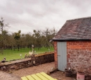 Detached Barn and view to neighbouring orchard